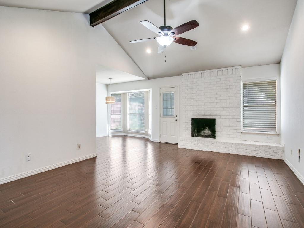 209 Ginger Lane Euless, TX 76039 - Photo 5 of 25 an empty room with wooden floor and windows