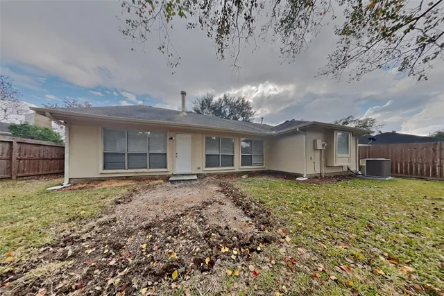 front view of a house with a garden