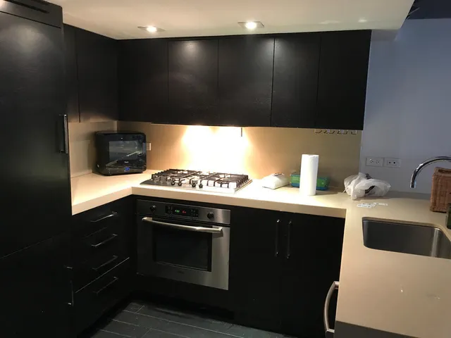 a room with water heater and wooden floor