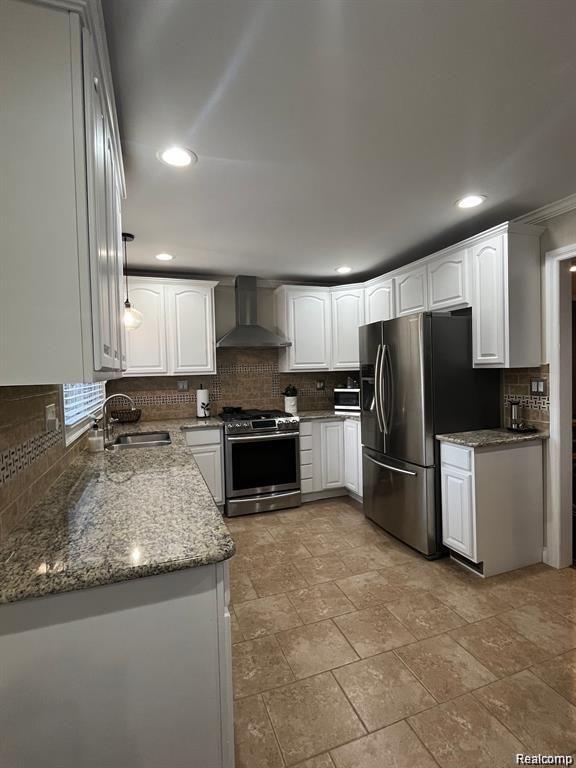 1341 Catalpa Drive Rochester, MI 48307 - Photo 7 of 9 Kitchen featuring white cabinetry, granite countertops, stainless steel appliances, a tile backsplash, and tile flooring