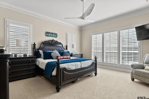 a spacious bedroom with a bed and a couch