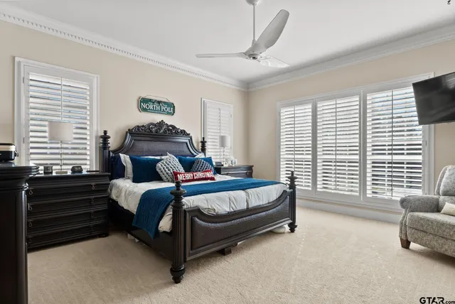 a spacious bedroom with a bed and a couch