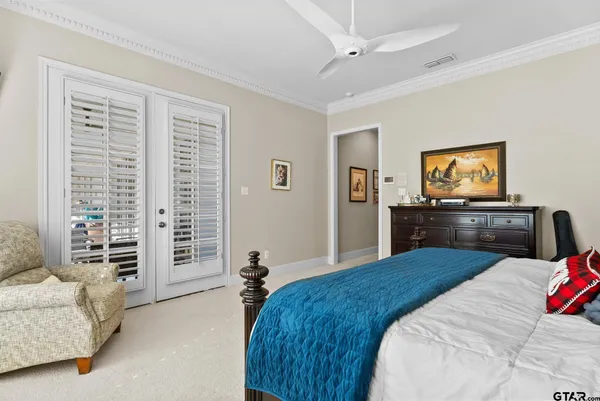 a bedroom with a bed and a couch