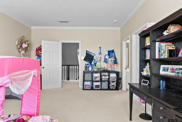 a room with furniture and a book shelf