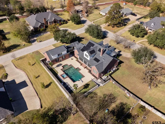 an aerial view of residential house with outdoor space