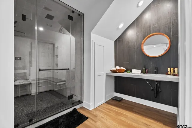 a bathroom with a sink and a mirror