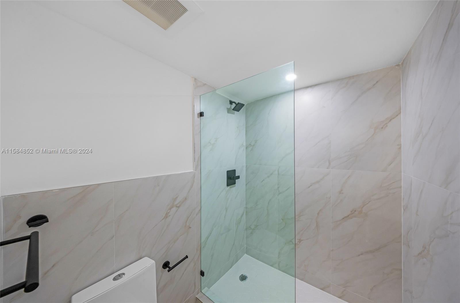 1335 Southwest 4th Street Miami, FL 33135 - Photo 22 of 59 a bathroom with a shower and toilet