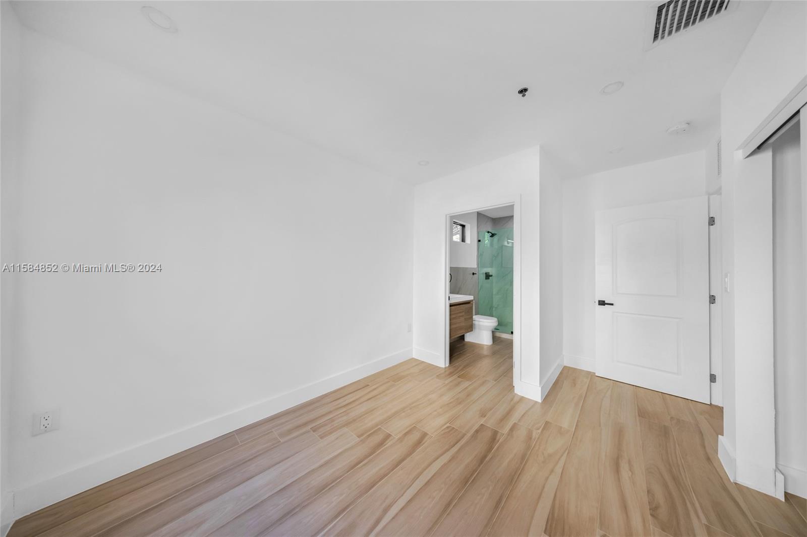 1335 Southwest 4th Street Miami, FL 33135 - Photo 44 of 59 a view of a room with wooden floor and a window