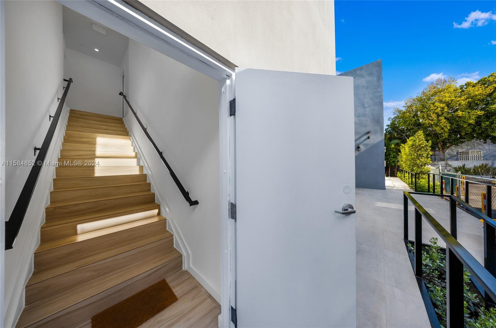 1335 Southwest 4th Street Miami, FL 33135 - Photo 46 of 59 a view of staircase with railing and white walls