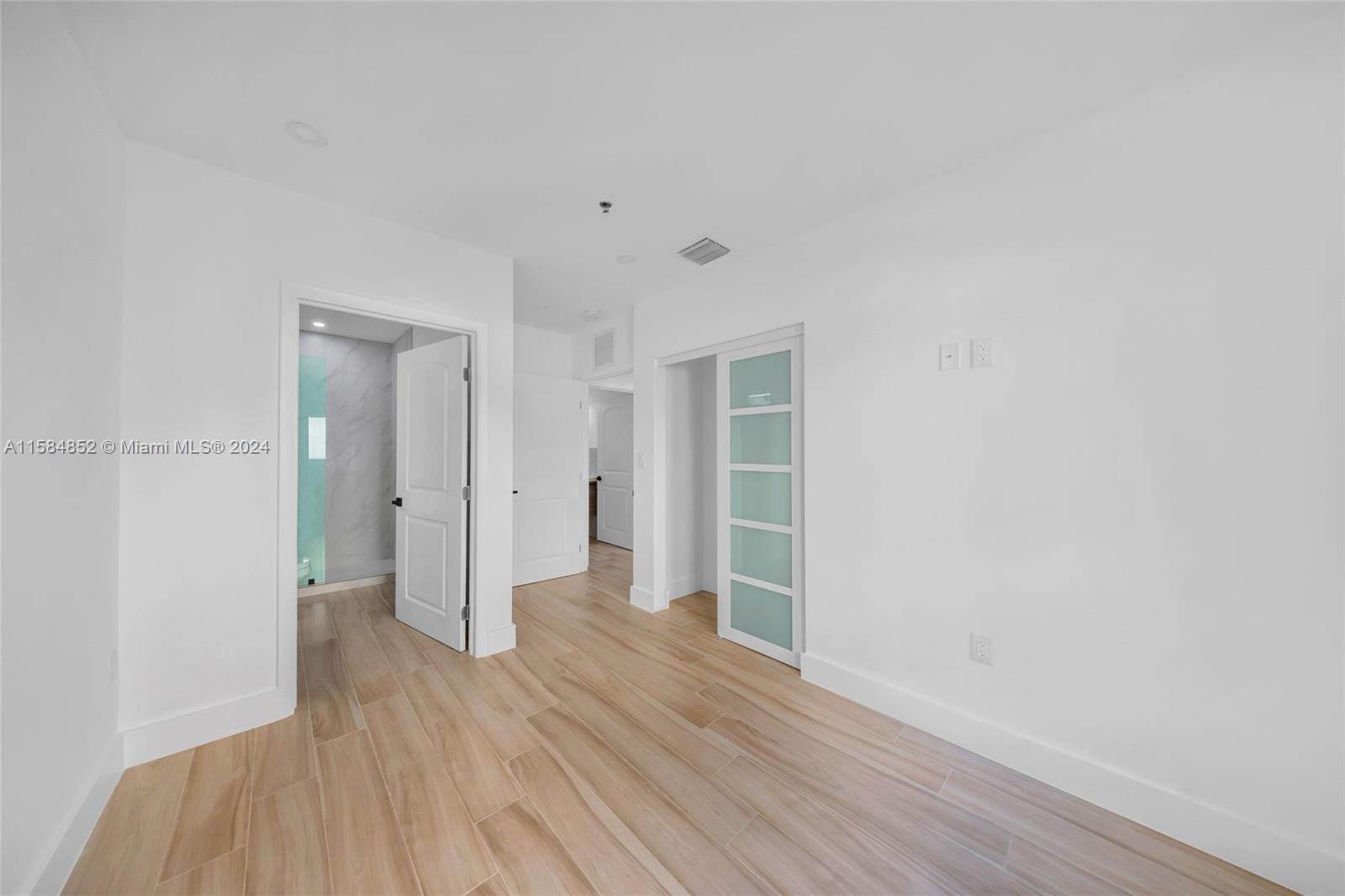 1335 Southwest 4th Street Miami, FL 33135 - Photo 47 of 59 a view of wooden floor and windows in a room