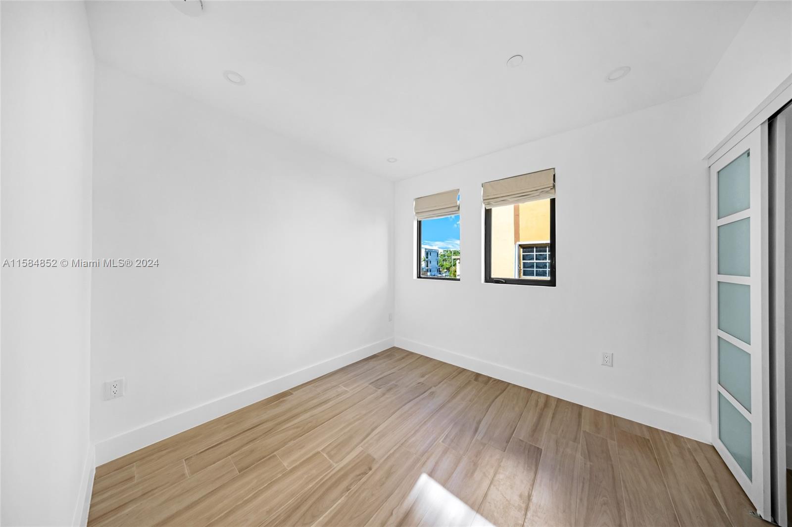 1335 Southwest 4th Street Miami, FL 33135 - Photo 49 of 59 wooden floor in an empty room with a window