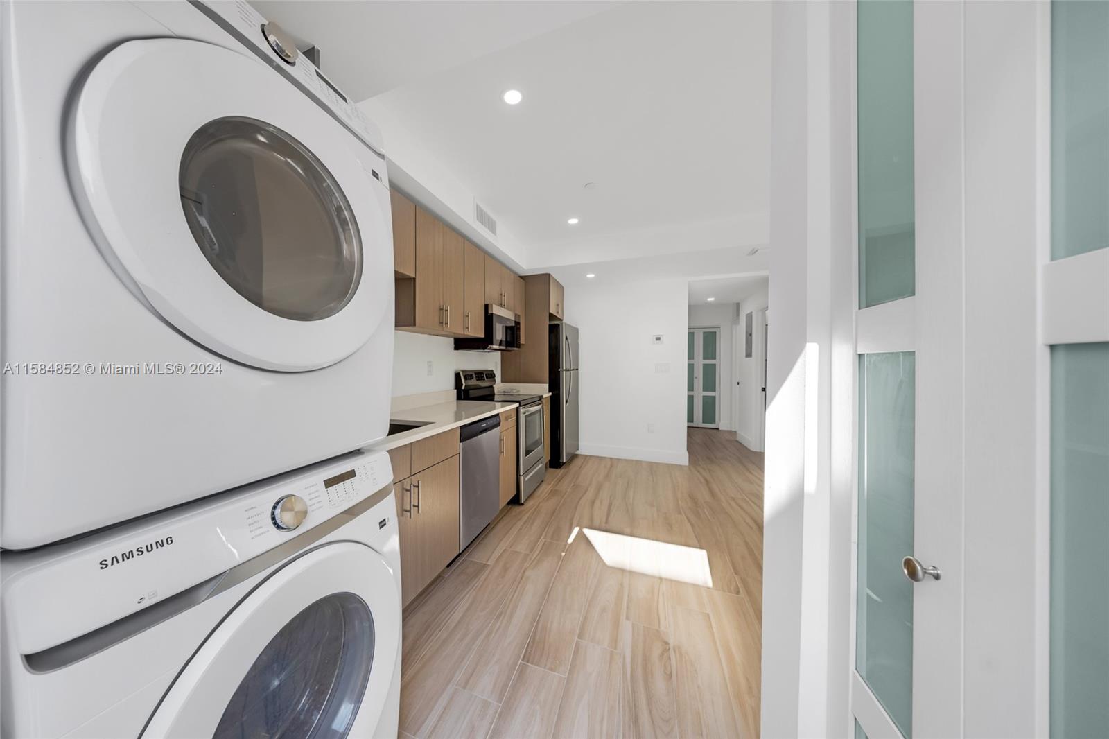1335 Southwest 4th Street Miami, FL 33135 - Photo 6 of 59 a living room with stainless steel appliances a washer and dryer