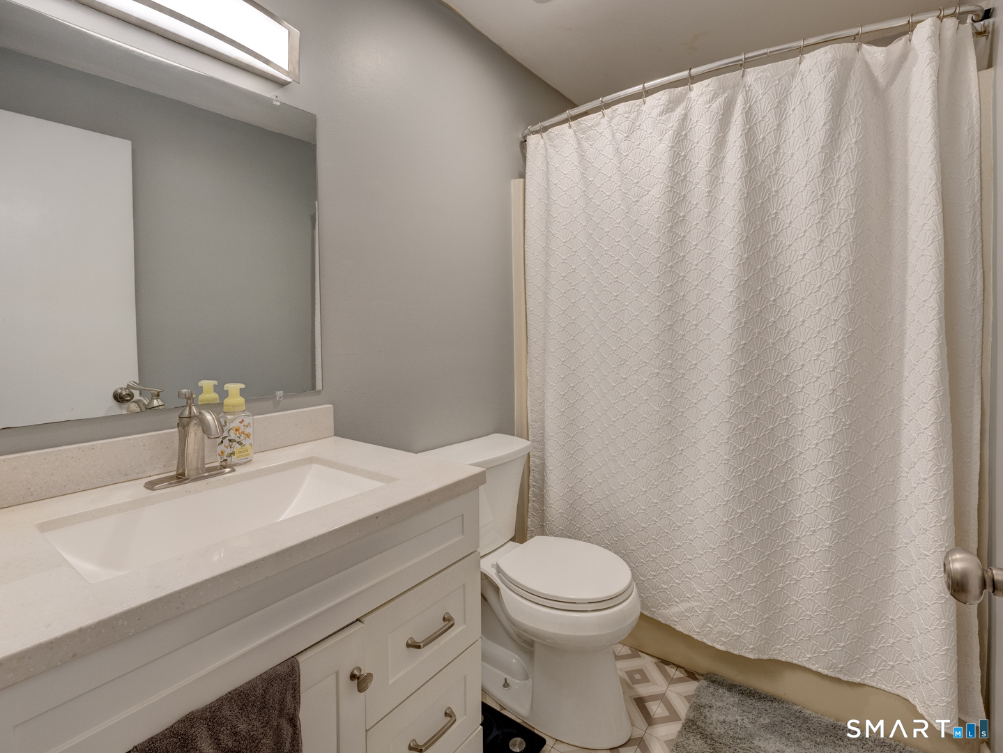 2 Branch Road, Unit 2C Thomaston, CT 06787 - Photo 19 of 26 a bathroom with a toilet a sink and curtain