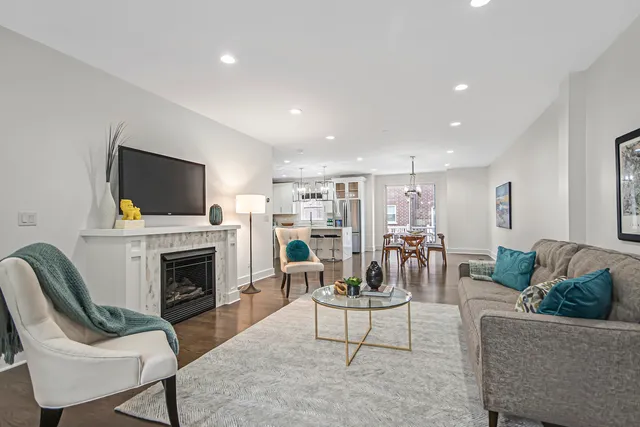 a living room with fireplace furniture and a flat screen tv