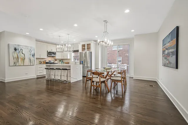 a kitchen with kitchen island a counter top space appliances and cabinets
