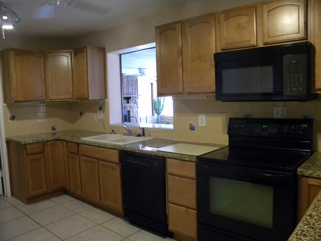 2964 East Bloomfield Road Phoenix, AZ 85032 - Photo 2 of 10 a kitchen with a sink stove and microwave