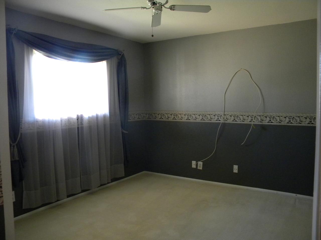 2964 East Bloomfield Road Phoenix, AZ 85032 - Photo 8 of 10 en empty room with a window