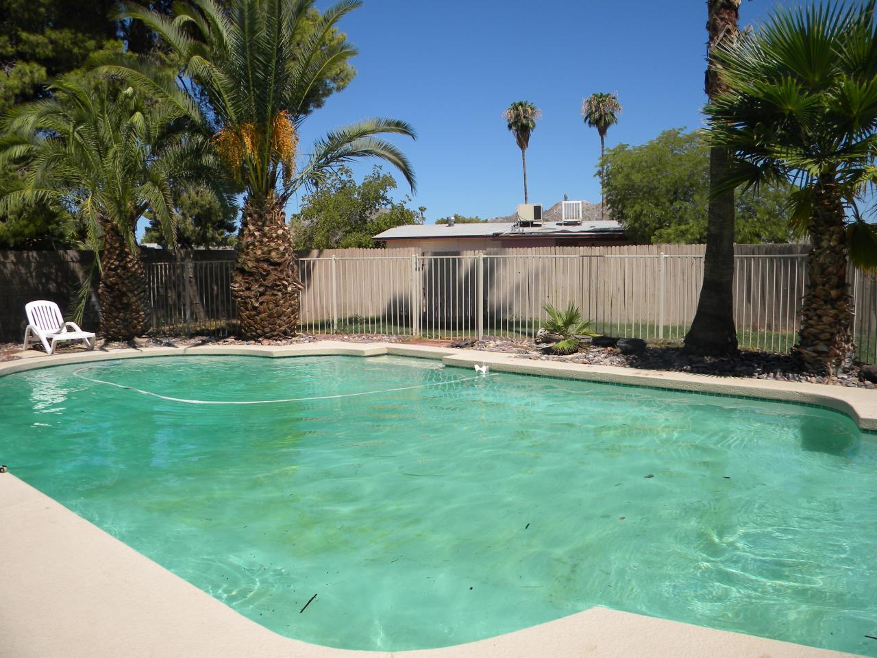 2964 East Bloomfield Road Phoenix, AZ 85032 - Photo 9 of 10 a backyard of a house with lots of green space