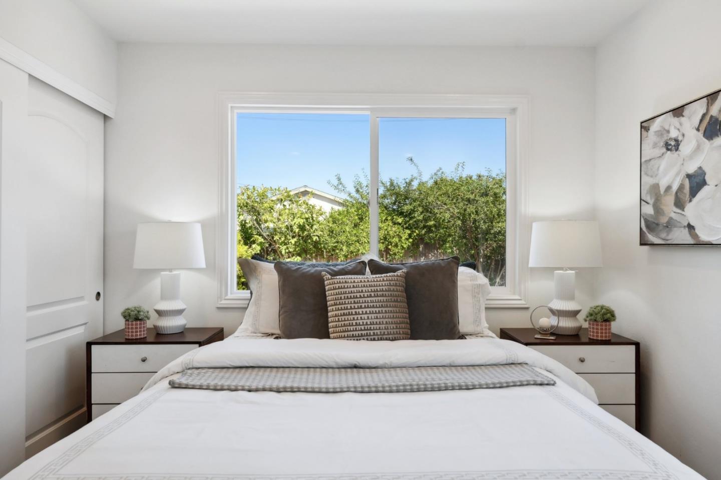 4615 Armour Drive Santa Clara, CA 95054 - Photo 14 of 35 a bedroom with a large bed and a potted plant