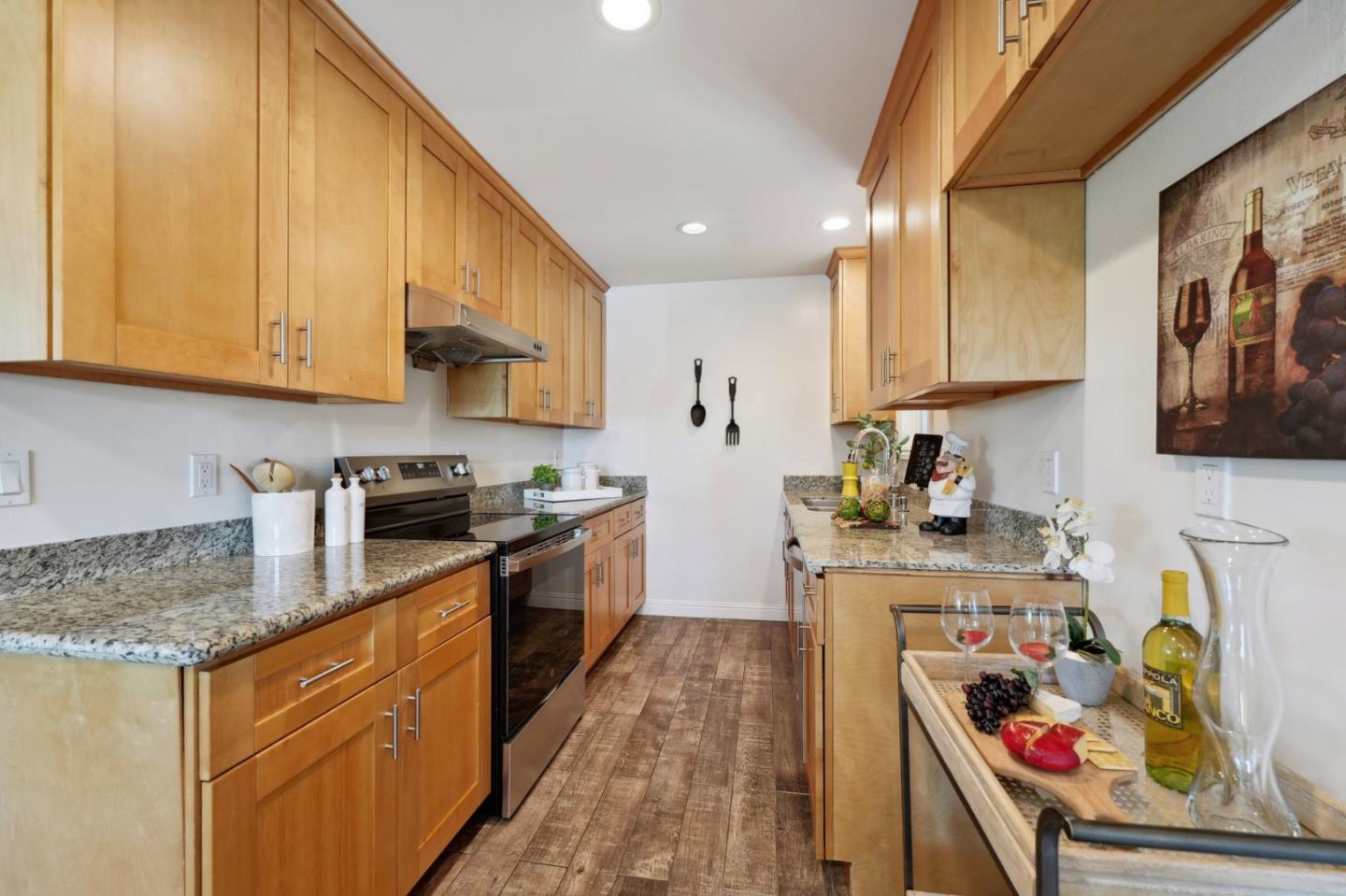 4615 Armour Drive Santa Clara, CA 95054 - Photo 7 of 35 a kitchen with stainless steel appliances granite countertop a sink stove and cabinets