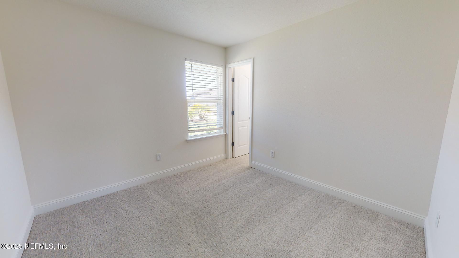 408 Bluejack Lane St. Augustine, FL 32095 - Photo 12 of 30 a view of an empty room with a window