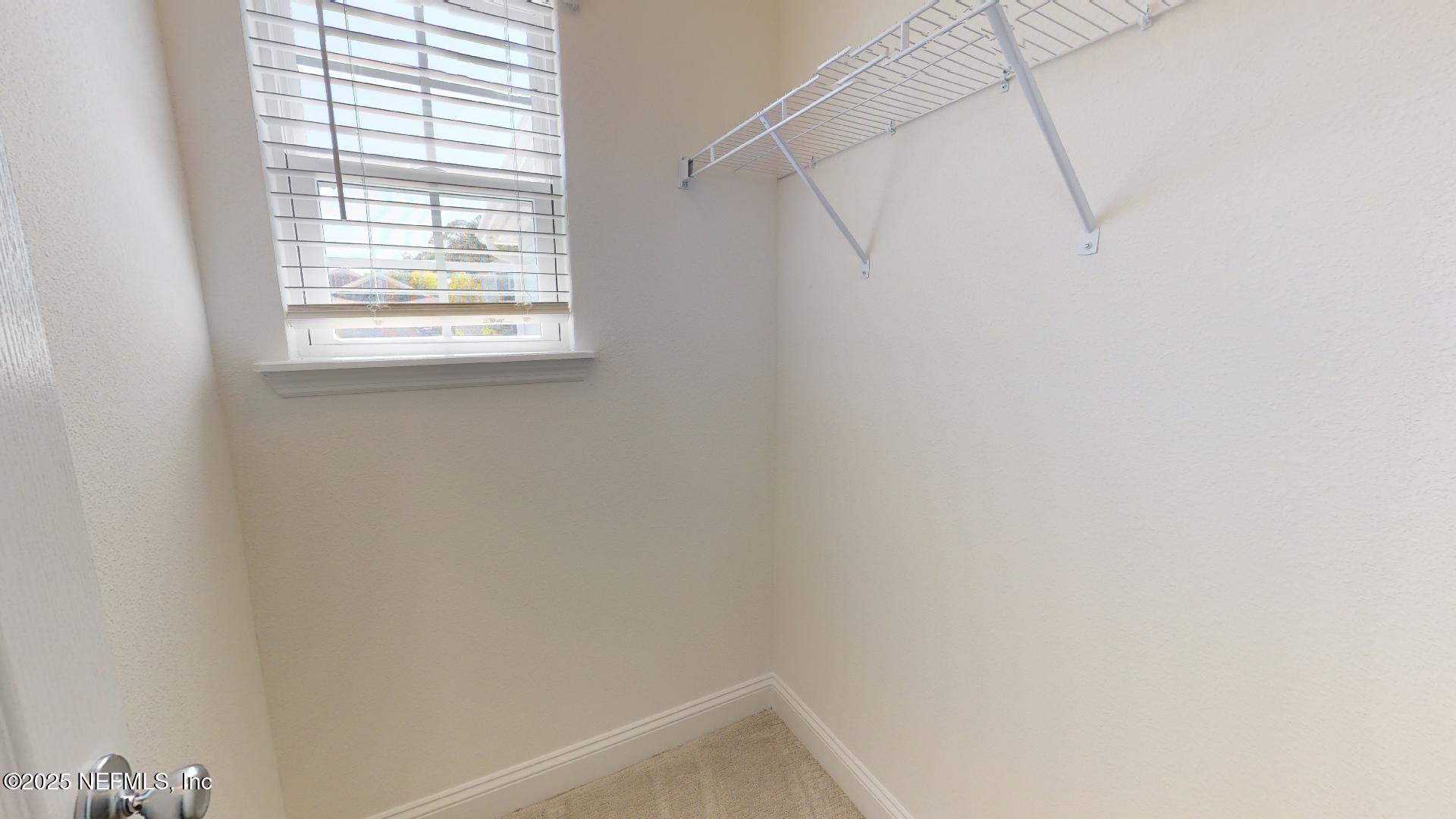 408 Bluejack Lane St. Augustine, FL 32095 - Photo 13 of 30 a small space with a window and a fan