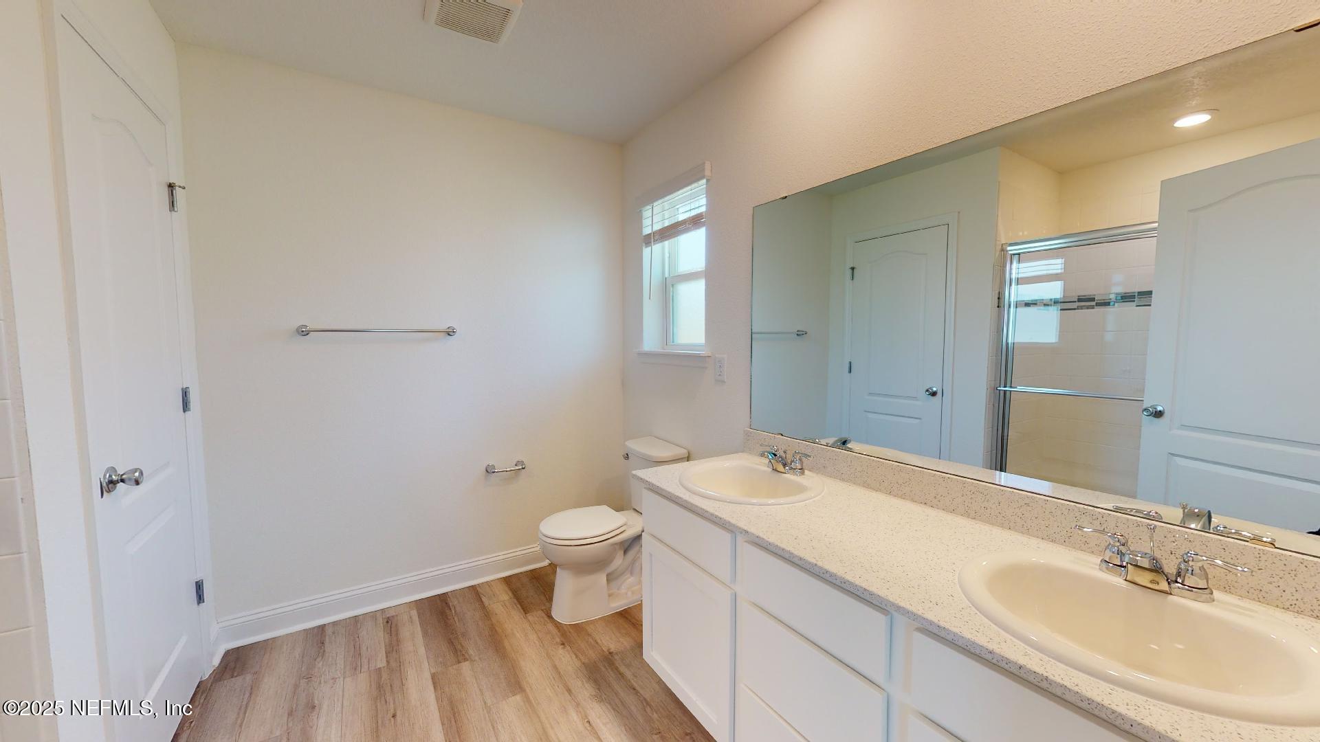 408 Bluejack Lane St. Augustine, FL 32095 - Photo 25 of 30 a bathroom with a sink a toilet and shower