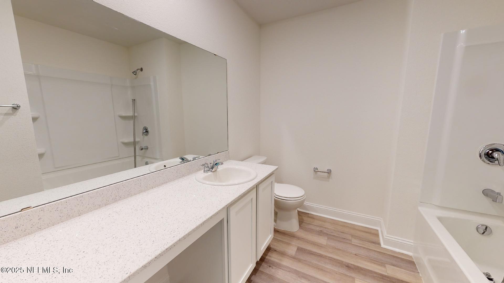 408 Bluejack Lane St. Augustine, FL 32095 - Photo 10 of 30 a bathroom with a sink a toilet and shower