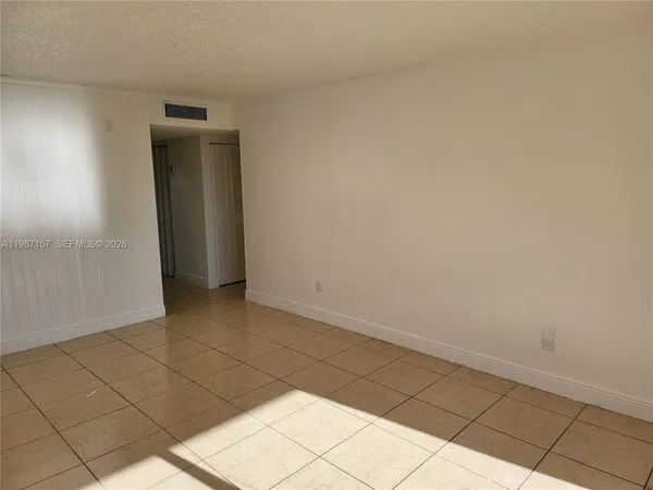 a white toilet sitting next to a bath tub