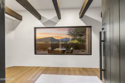 a living room with furniture a fireplace and a table