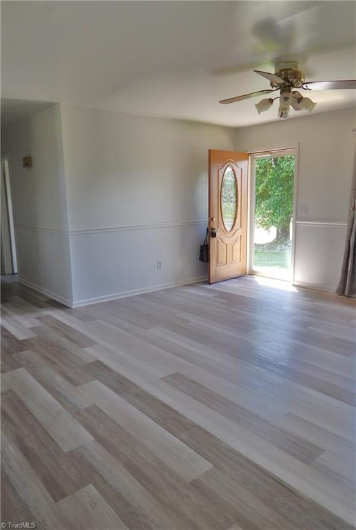 1048 State Line Church Road Westfield, NC 27053 - Photo 8 of 29 This view shows the front door and hallway entry and those beautiful new floors shine with natural light!! Main living area was also recently painted!