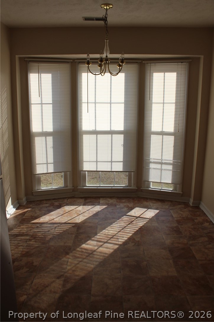 7805 Gallant Ridge Drive Fayetteville, NC 28314 - Photo 10 of 25 a view of an empty room with a window
