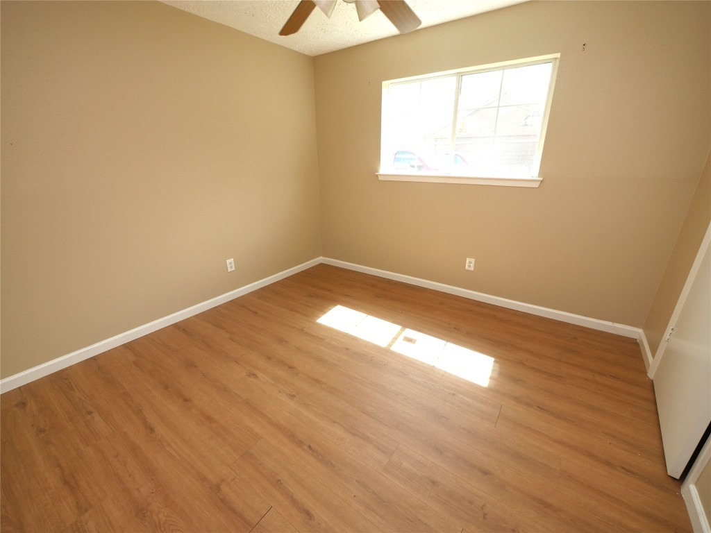 6826 Addicks Clodine Road Houston, TX 77083 - Photo 9 of 12 Bright, spacious rooms with updated flooring and natural light.