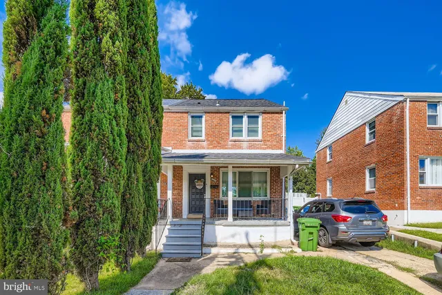 a front view of a house with yard