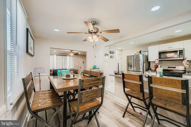 a view of a dining room with furniture and a livingroom