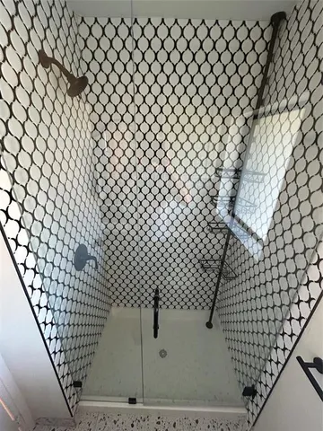 a bathroom with a sink and a shower