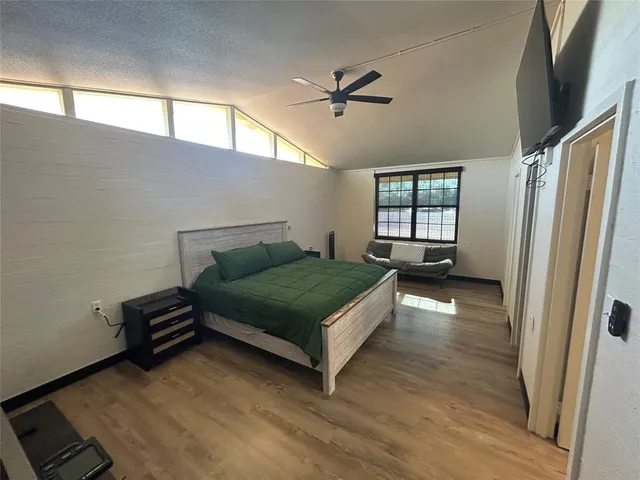 a bedroom with a bed and window