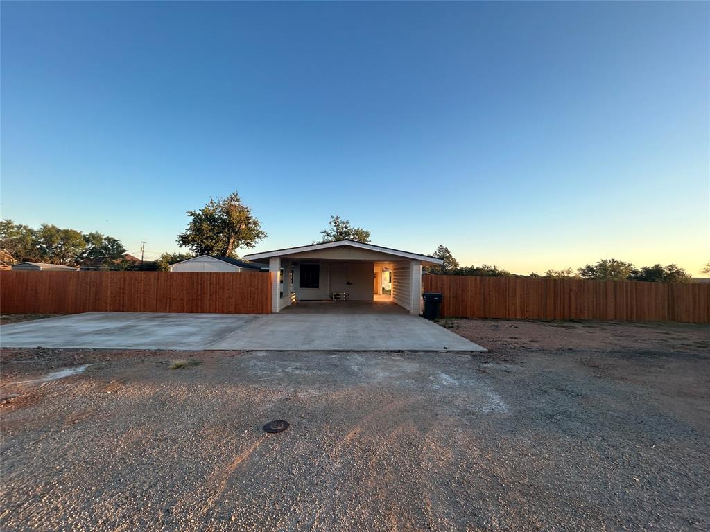 5400 Ridgeline Drive Abilene, TX 79606 - Photo 27 of 33 a view of a dry yard with wooden fence