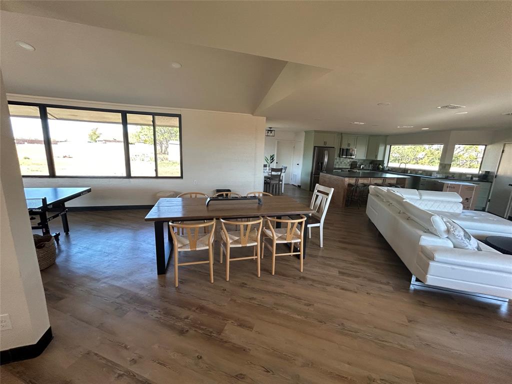 5400 Ridgeline Drive Abilene, TX 79606 - Photo 7 of 33 a view of a dining room with furniture and wooden floor