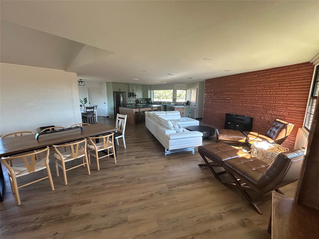 5400 Ridgeline Drive Abilene, TX 79606 - Photo 8 of 33 a living room with furniture and a fireplace