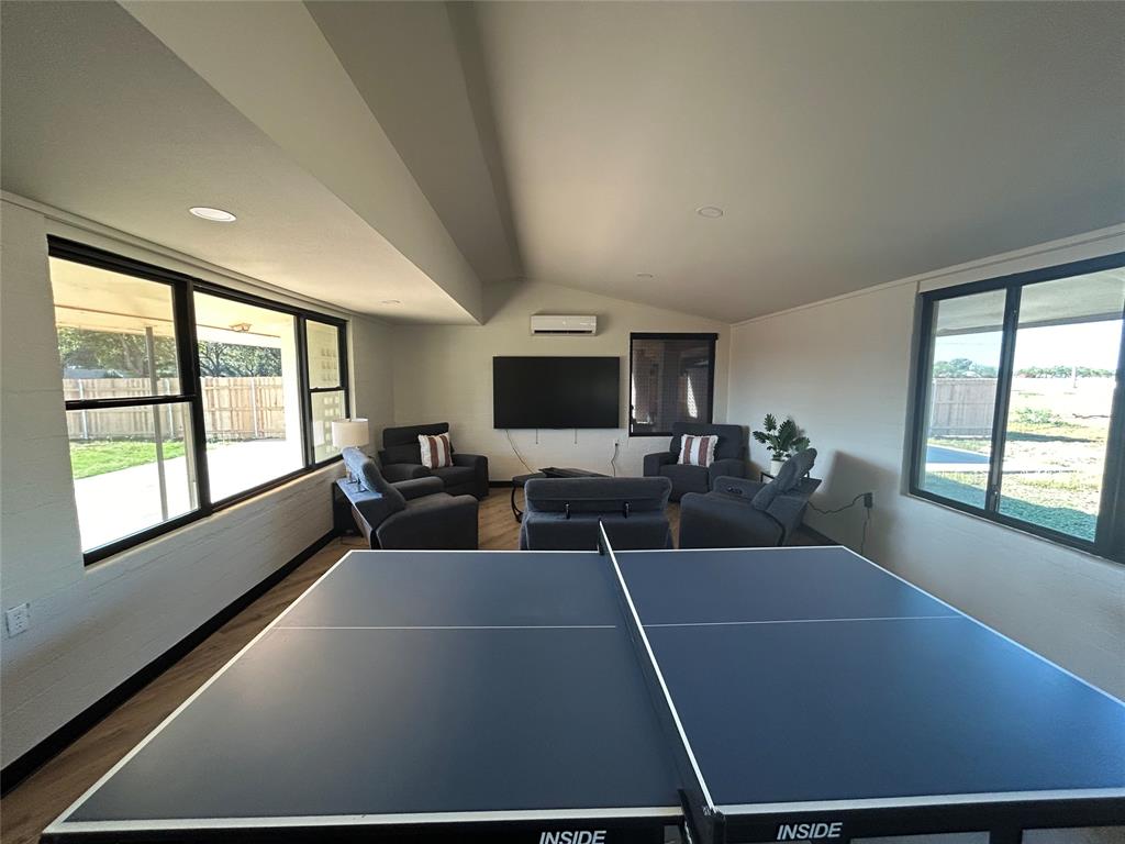 5400 Ridgeline Drive Abilene, TX 79606 - Photo 9 of 33 a living room with furniture tv and large windows