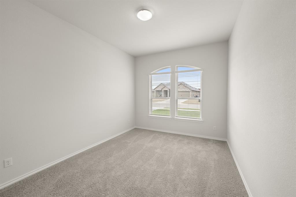 2607 Streamside Drive Burleson, TX 76028 - Photo 13 of 27 an empty room with a window