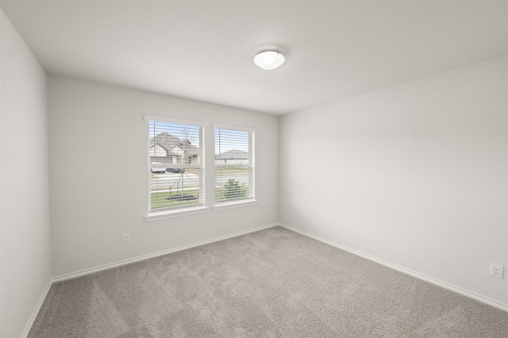 2607 Streamside Drive Burleson, TX 76028 - Photo 14 of 27 an empty room with a window