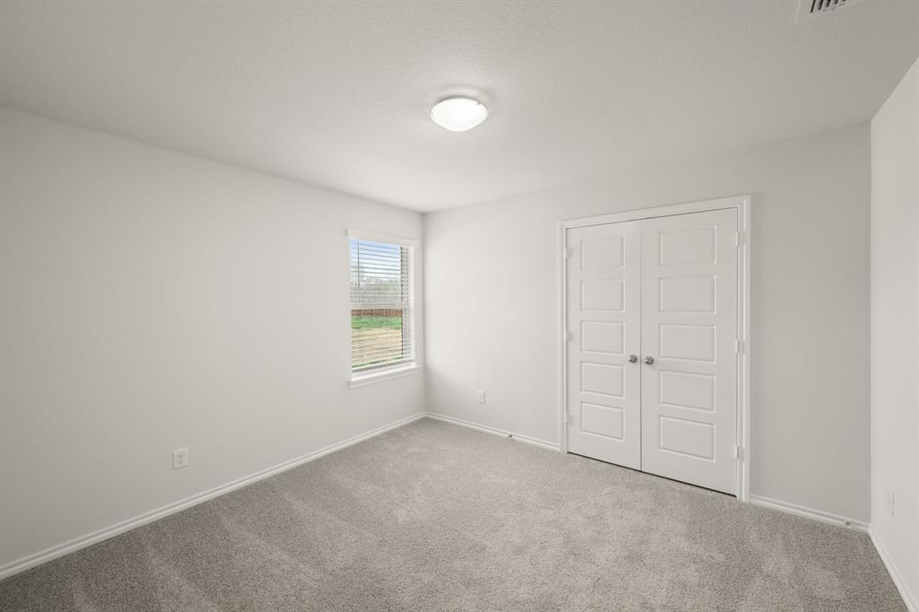2607 Streamside Drive Burleson, TX 76028 - Photo 15 of 27 a view of an empty room with a window