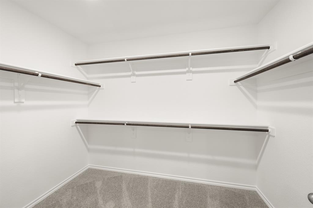 2607 Streamside Drive Burleson, TX 76028 - Photo 24 of 27 a view of an empty walk in closet