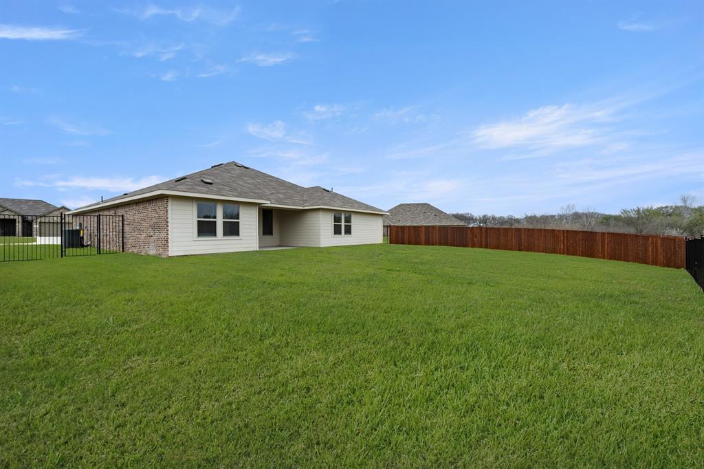 2607 Streamside Drive Burleson, TX 76028 - Photo 25 of 27 a view of a house with a big yard