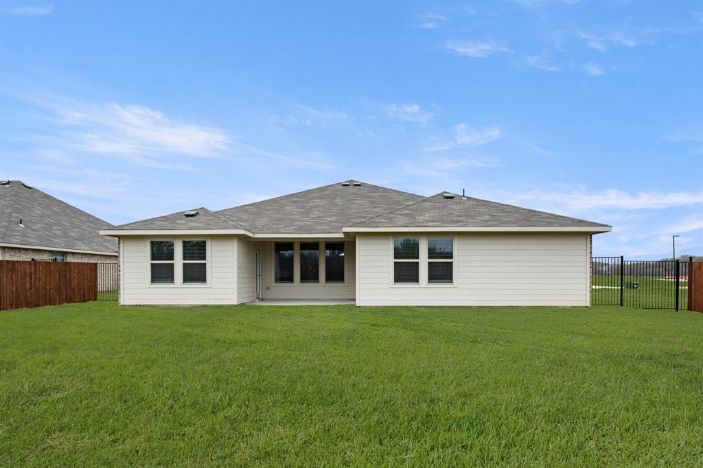 2607 Streamside Drive Burleson, TX 76028 - Photo 27 of 27 a front view of house with yard and green space