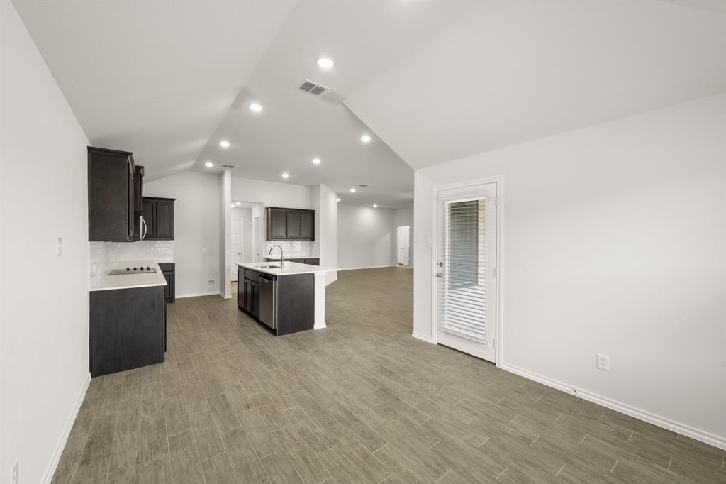 2607 Streamside Drive Burleson, TX 76028 - Photo 9 of 27 a view of kitchen with stainless steel appliances kitchen island microwave and stove