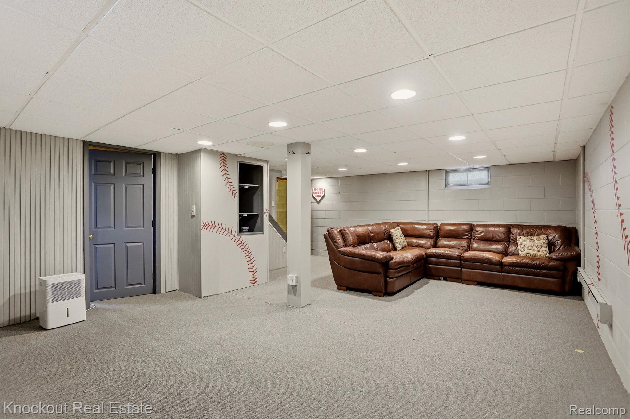 1608 South Pinnebog Road Bad Axe, MI 48413 - Photo 36 of 54 Living area featuring a paneled ceiling, recessed lighting, light carpet, and a baseboard heating unit