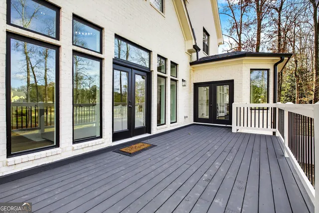 a view of empty room with wooden floor and fireplace